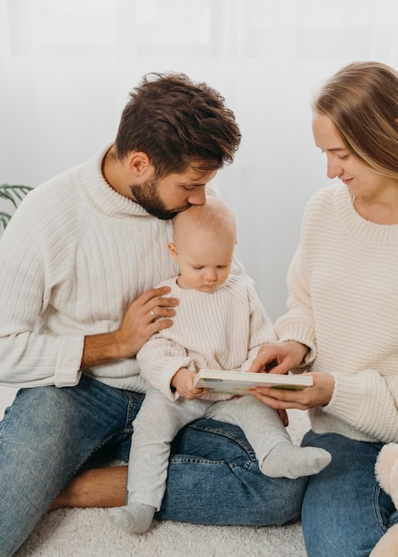 Mom and dad spending time with their baby at home