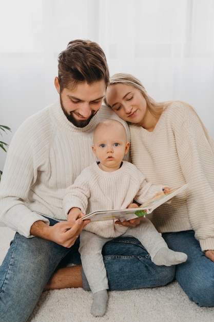 Mom and dad with little baby at home