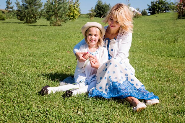 Mom and daughter are having fun together on a bright sunny day