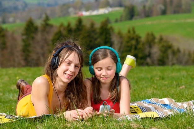 Mom and daughter listening music 