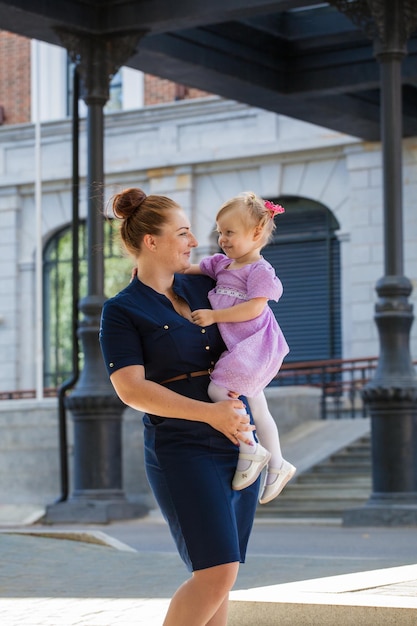 Mom and daughter for a walk To hold the baby in your arms