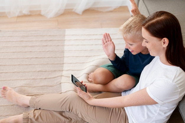 Photo mom doing a family videocall with her son