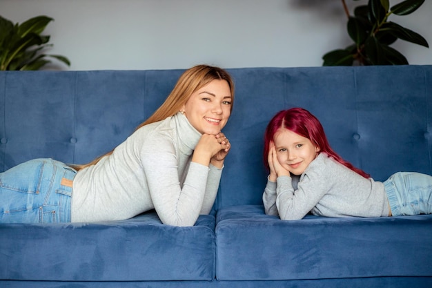 Mom and her daughter play at home Family vacation and togetherness