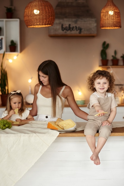 Mom in the kitchen prepares a healthy breakfast for her children.