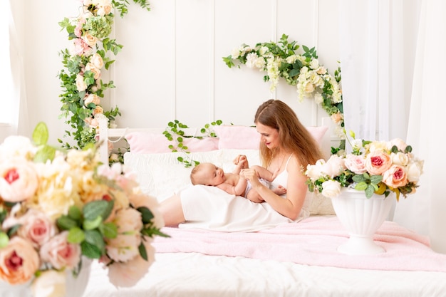 Mom playing with baby at home