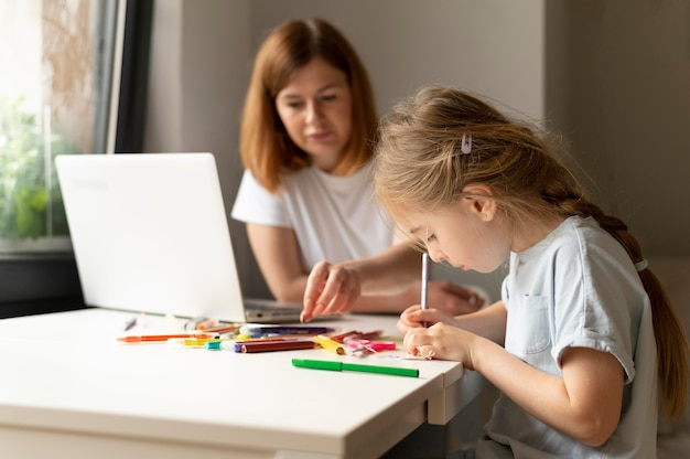 Mom playing with her daughter at home