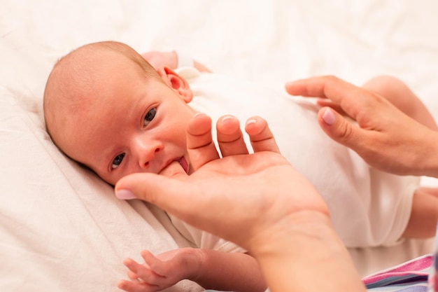 Mom prepare her newborn baby to breastfeed