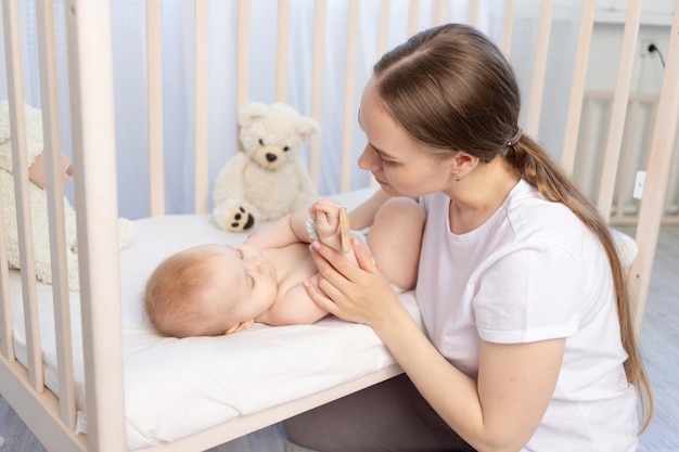 Mom puts baby to sleep in the crib or gives him a rodent happy family