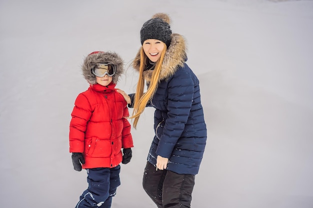 Mom puts on ski glasses for her son