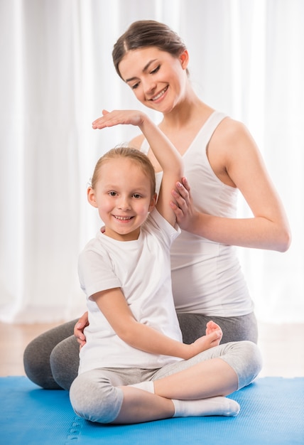 Mom shows her little daughter how to do it right.