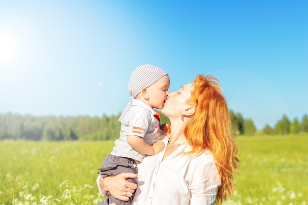 Mom and son are playing in the field