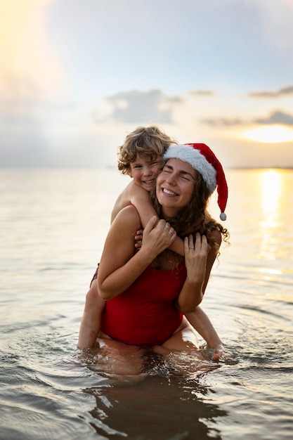 Mom and son celebrating christmas in july