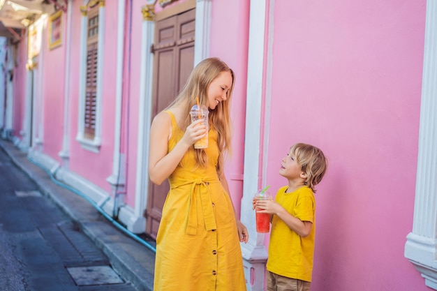 Mom and son tourists on the Street in the Portugese style Romani in Phuket Town Also called Chinatown or the old town Traveling with kids concept