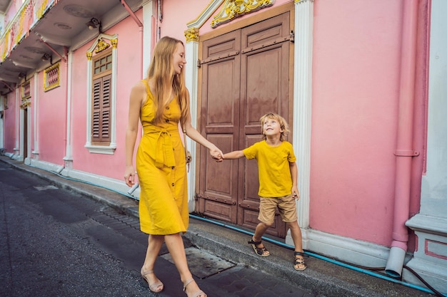 Mom and son tourists on the Street in the Portugese style Romani in Phuket Town Also called Chinatown or the old town Traveling with kids concept