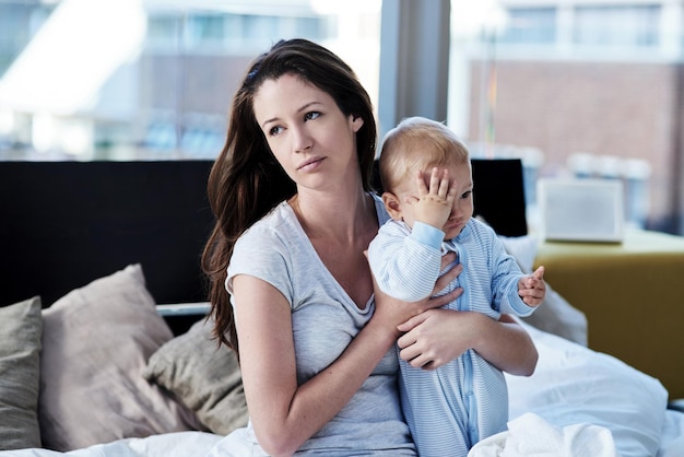 Moments in motherhood Shot of a mother and her baby boy at home