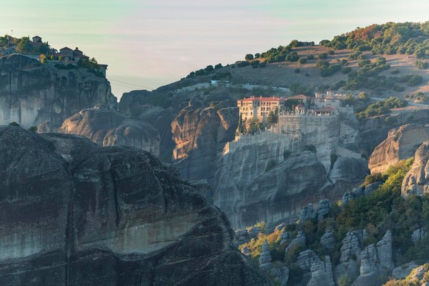 Monasteries of St Rousanou and St Nicholas Anapausas immense monolithic pillar green foliage Meteora