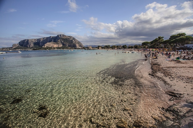 Mondello beach' seascape with tourists and bathers during the summer