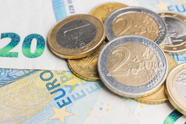 Money, euro coins and paper banknotes, close-up view