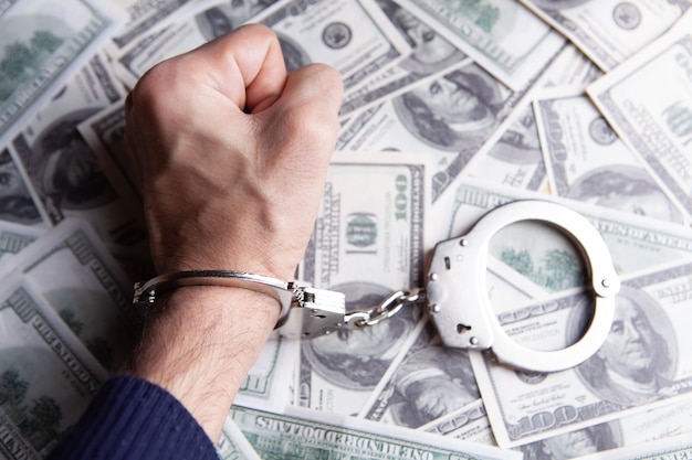 Money and handcuffs bribery of the authorities