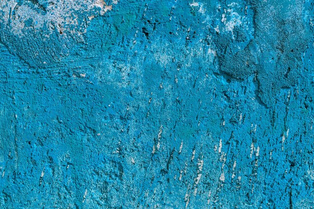 Monocolor blue painted flat concrete surface closeup texture