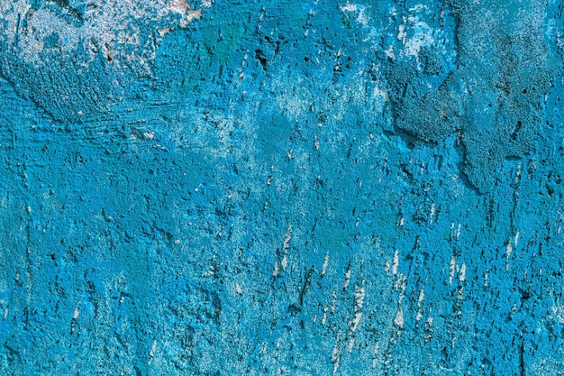 Monocolor blue painted flat concrete surface closeup texture