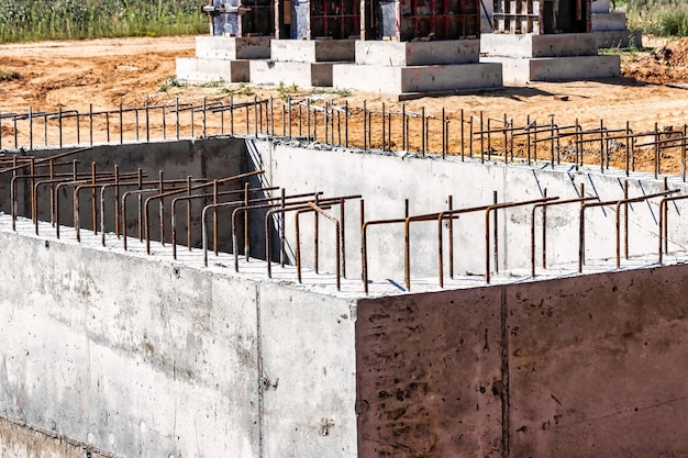 Monolithic reinforced concrete foundations for the construction of a residential building Grillage at the construction site Construction pit with foundations