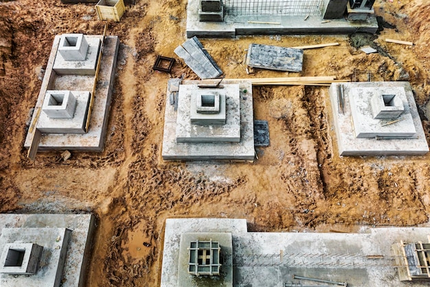 Monolithic reinforced concrete foundations or grillages for the construction of a large modern residential building Rostverk at the construction site Foundation for the building View from above