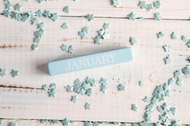 The month of January is written on a wooden bar. Background for the calendar.