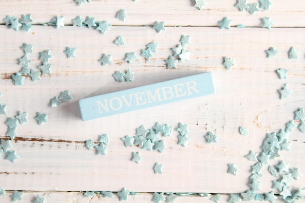 The month of November is written on a wooden bar. Background for the calendar.