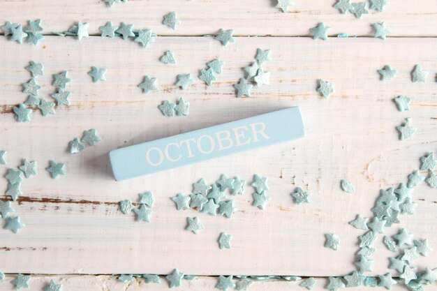 The month of October is written on a wooden bar. Background for the calendar.