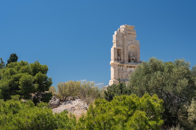 Monument of Filopappos above the trail on the summit of Filopappou Hill