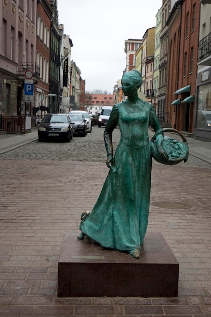 Monument of gingerbread maker on the streets of Torun