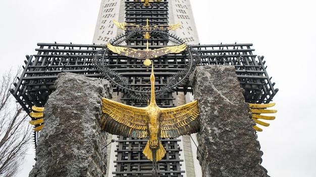 Monument with bronze figure of stork to Holodomor Victims