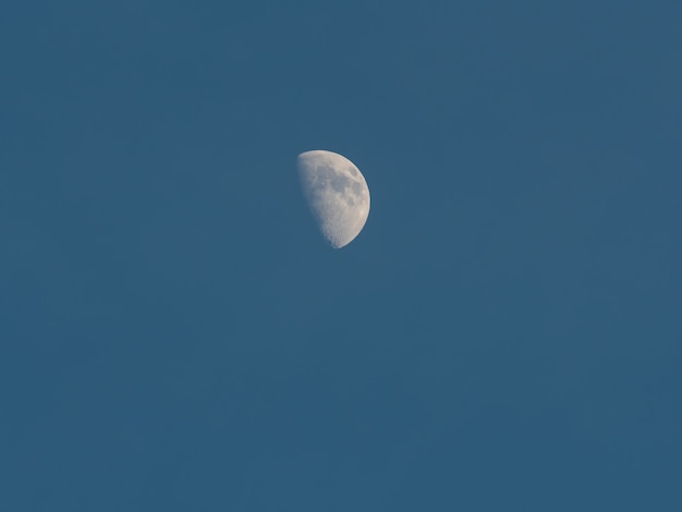 Moon day in the blue sky