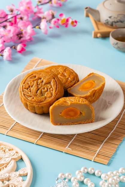 A mooncake  is a Chinese bakery product traditionally eaten during the Mid-Autumn Festival.