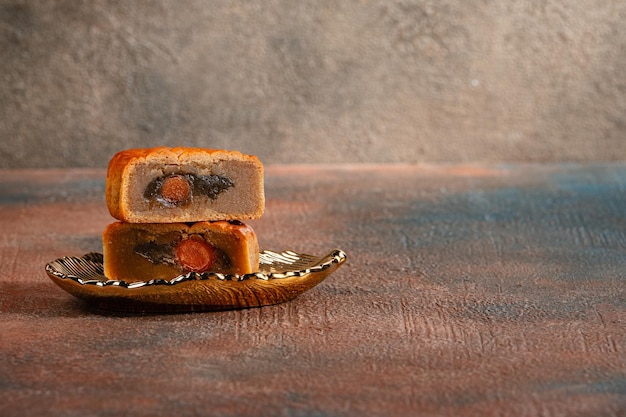 A mooncake is a Chinese bakery product traditionally eaten during the MidAutumn Festival