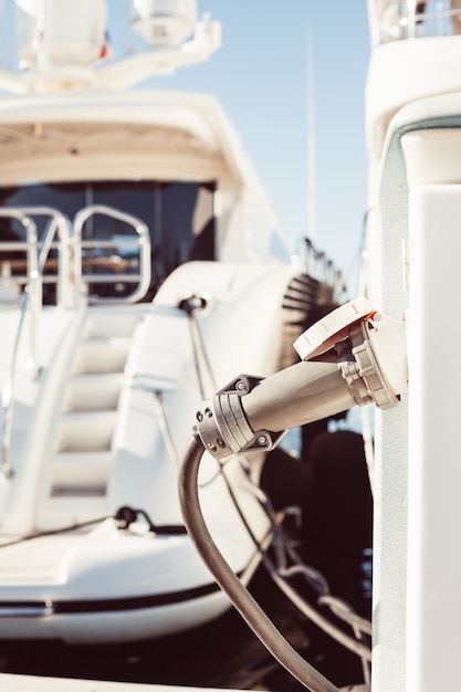 Moored yachts charching with fuel and electricity