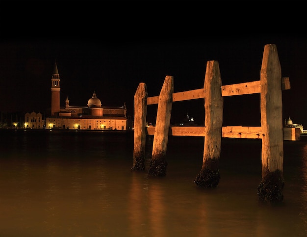 Mooring Posts in a Venetian canal at night