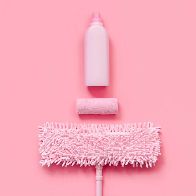 MOP, rag and detergent-pink set for spring cleaning. Top view