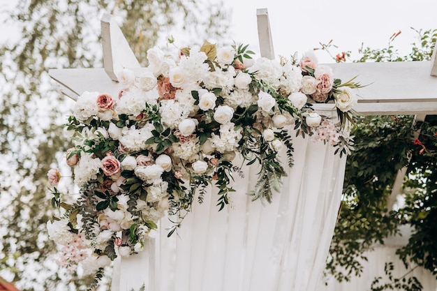 Morden wedding floral decor outside.Artificial rose and white flowers