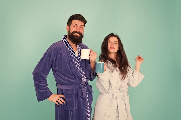 More coffee relax with coffee happy family day man and woman drink cup of tea Spending great time at home couple in love enjoy morning wear cosy robe Tastes delicious Breakfast time