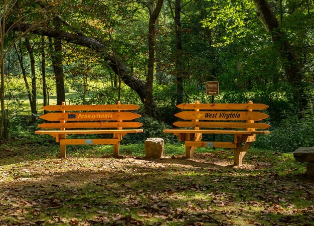 Morgantown WV 20 August 2020 Benches mark the border in Mason Dixon Historical Park between West Virginia and Pennsylvania