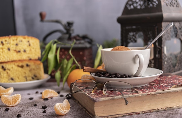 Morning breakfaststill life with coffe cakes cinnamon nuts and branches of spruce