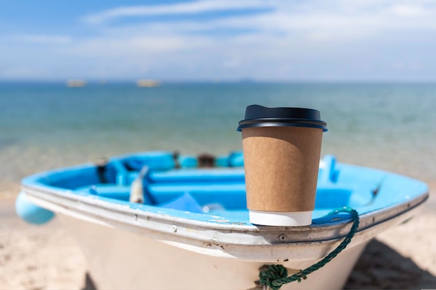 Morning coffee cup on the boat with sea background