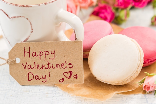 Morning coffee with flowers and macaroons. Mather's day  Valentine'  concept.