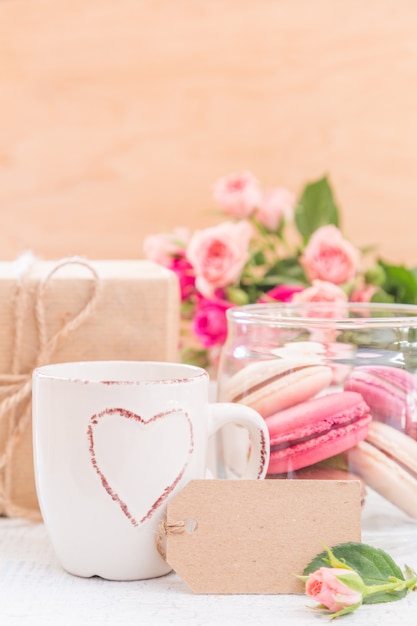 Morning coffee with flowers and macaroons. Mather's day Valentine' concept.