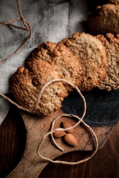 Morning cookies with almonds on the wood board. Selective focus.