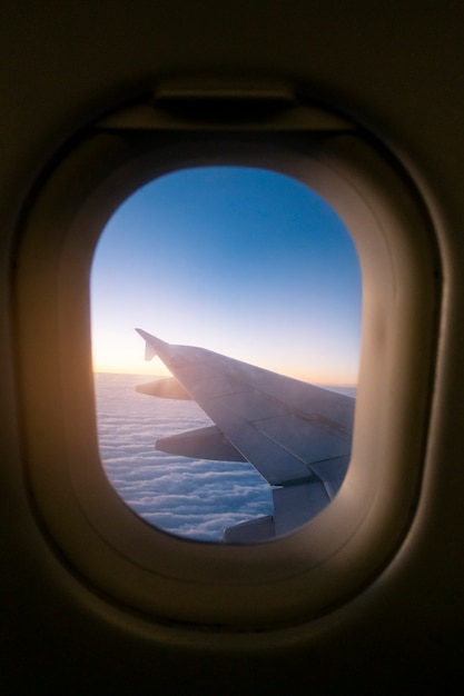 Morning light from window of  airplane wing 