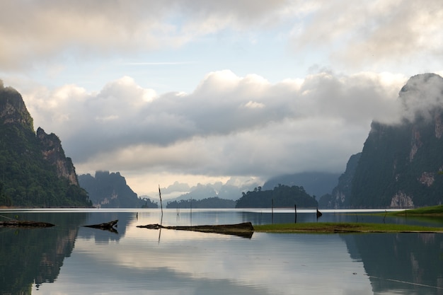 Morning mountain landscape and mist with mountains reflected in the water