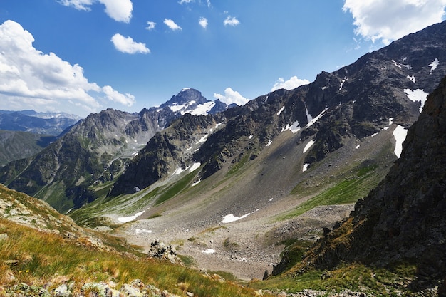 Morning in the mountains, a fabulous landscape of the Caucasus mountains. Hike climbing mountains, peaks and snowy peaks. Clean fresh air on a Sunny morning among the rock